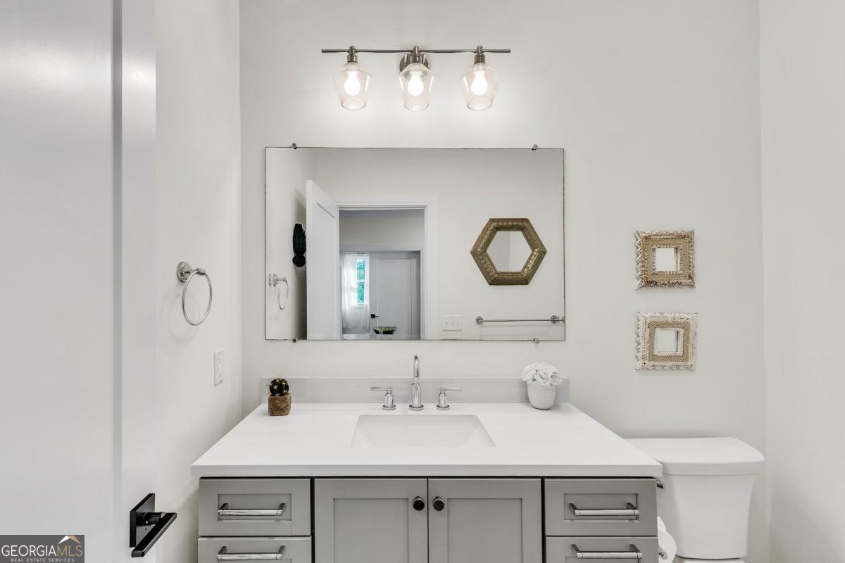 822 Dancy Avenue Savannah, GA 31419 - Photo 59 of 73 a bathroom with a sink and a mirror