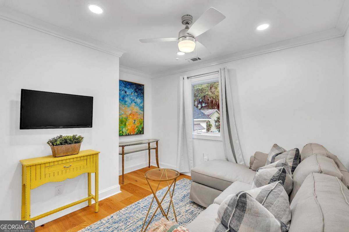 822 Dancy Avenue Savannah, GA 31419 - Photo 62 of 73 a living room with furniture and a flat screen tv