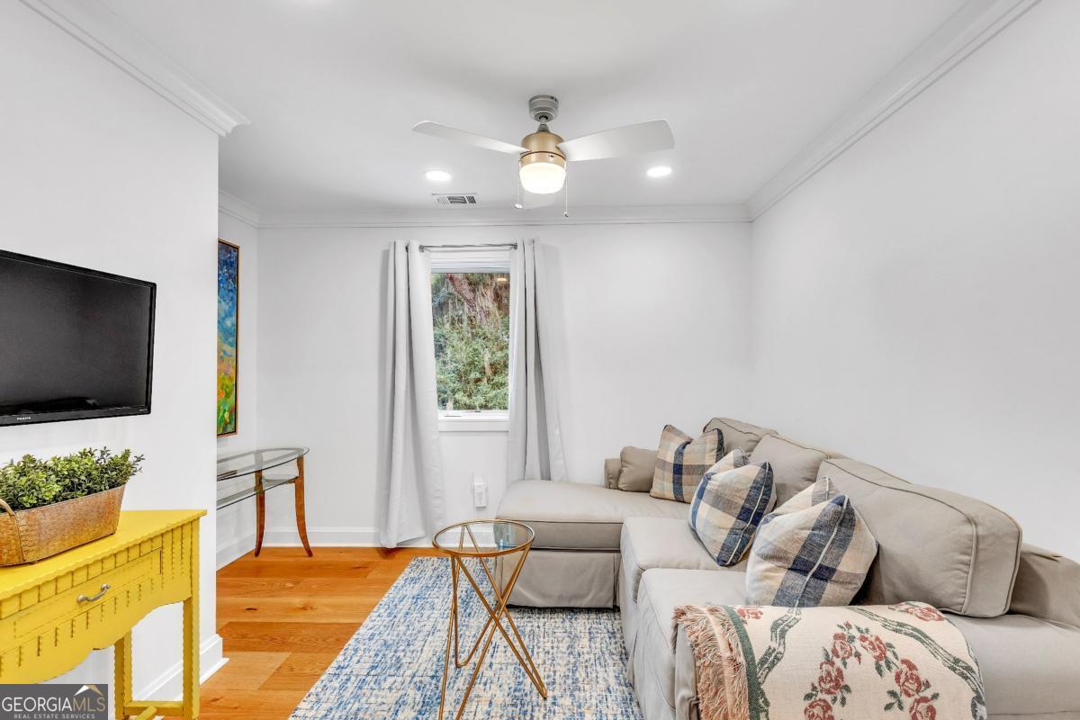 822 Dancy Avenue Savannah, GA 31419 - Photo 63 of 73 a living room with furniture and a flat screen tv