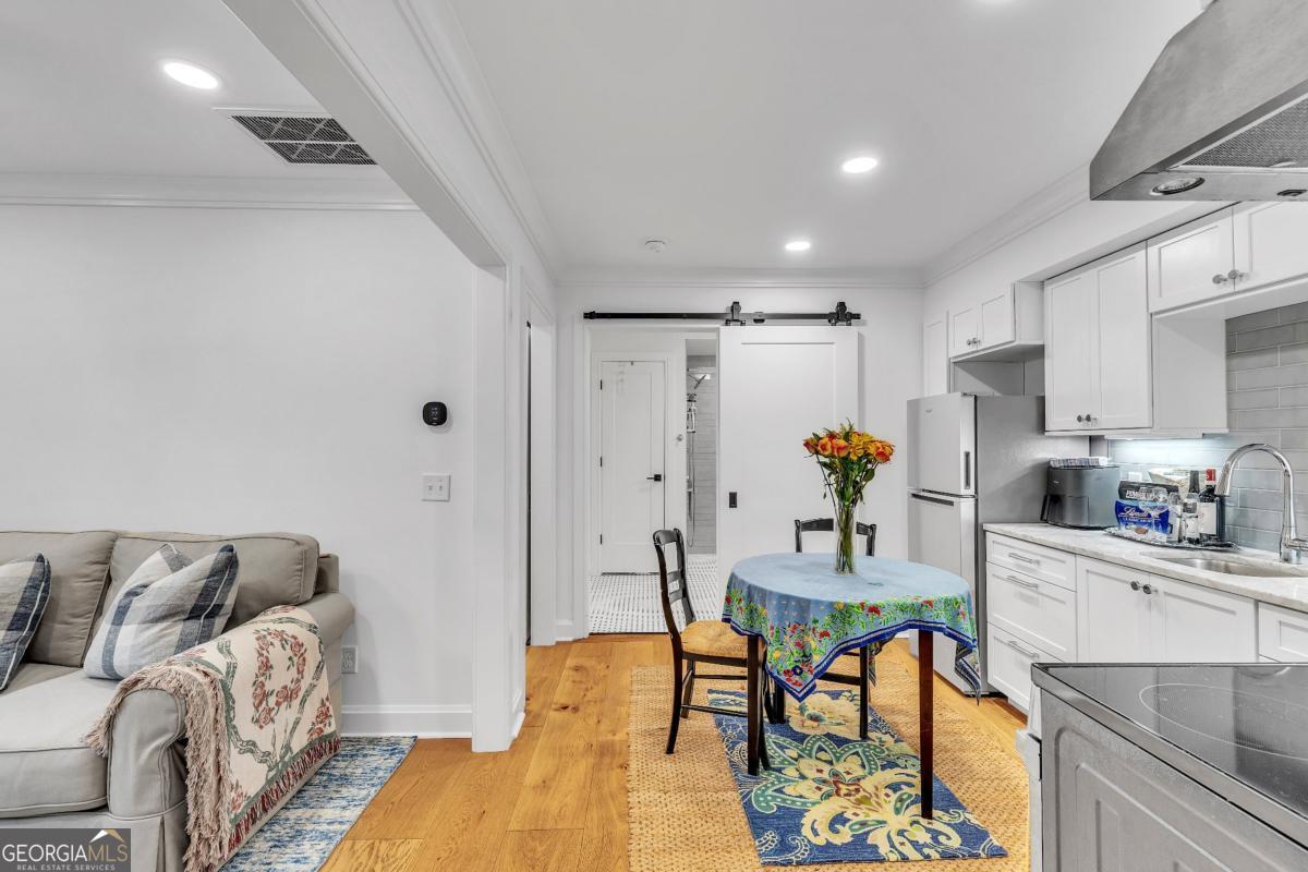 822 Dancy Avenue Savannah, GA 31419 - Photo 64 of 73 a living room with furniture and a dining table with kitchen view