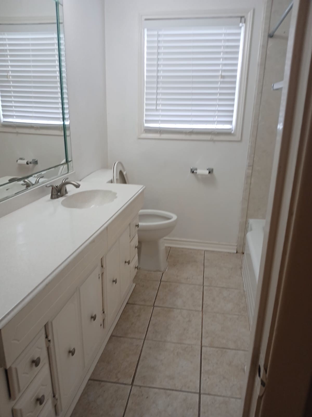 4214 Gano Street Houston, TX 77009 - Photo 7 of 12 a bathroom with a sink a toilet and a window