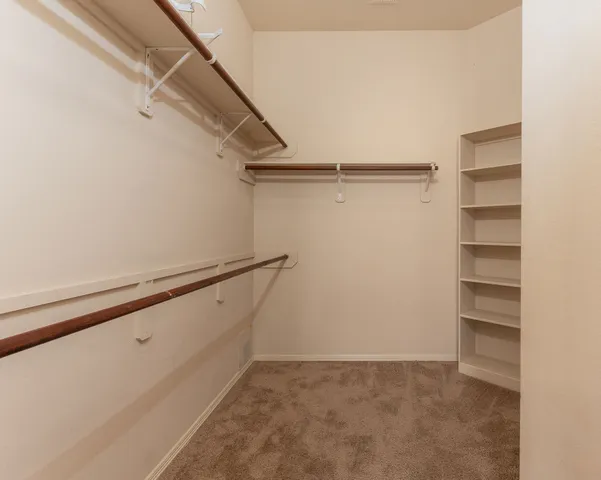 a view of an empty walk in closet
