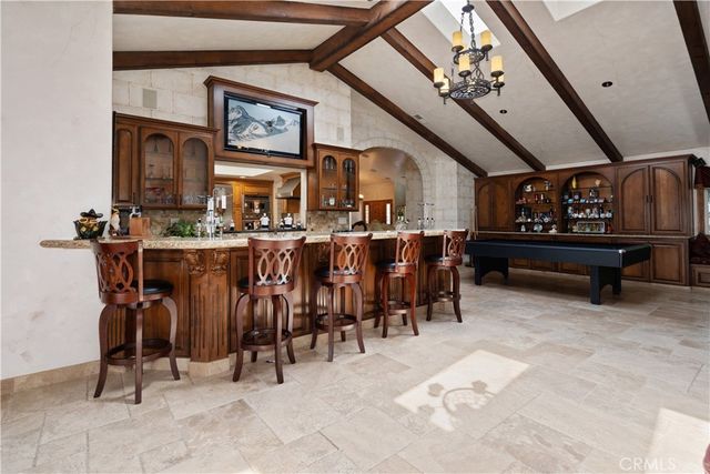 a kitchen with stainless steel appliances granite countertop sink stove and cabinets