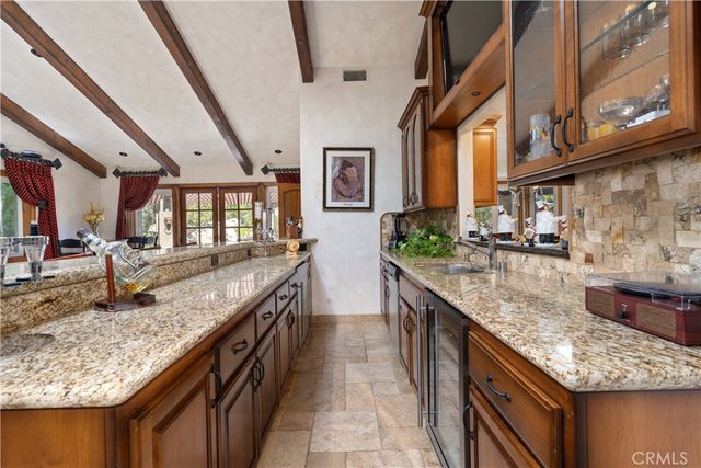a view of a kitchen with washer and dryer