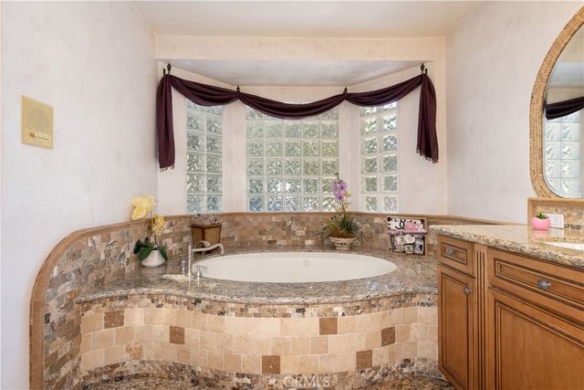 a view of a backyard with sitting area