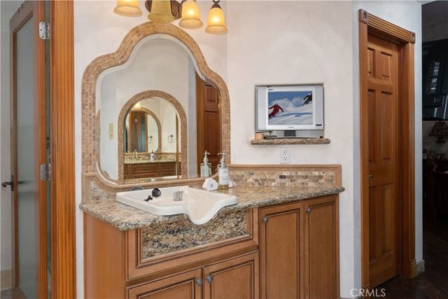 a living room with furniture a fireplace and a table