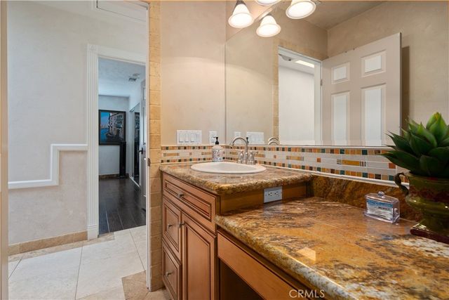 a view of a chairs and table in the back yard of the house