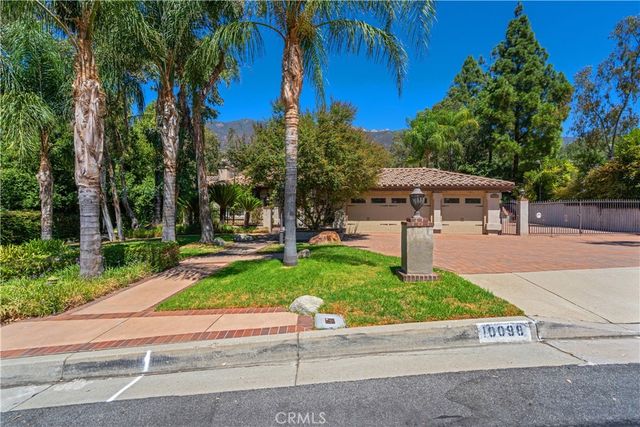 a view of a dining room with furniture and a chandelier