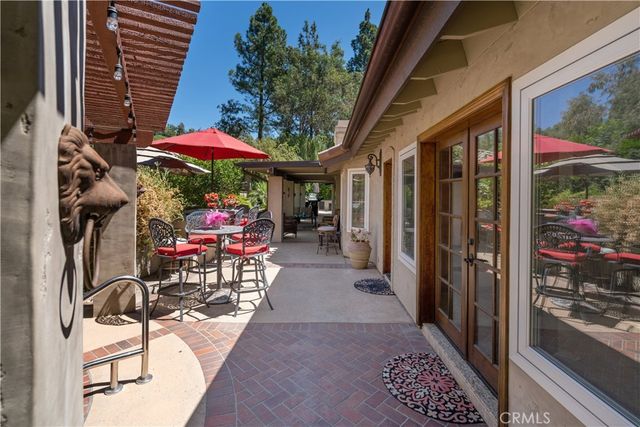 an aerial view of a house with a yard and lake view