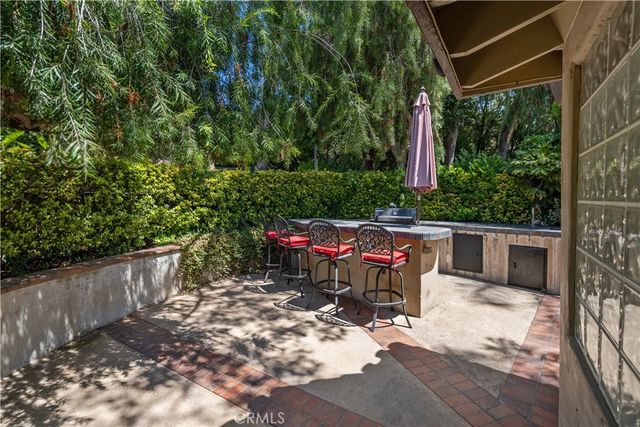 an aerial view of house with yard and mountain
