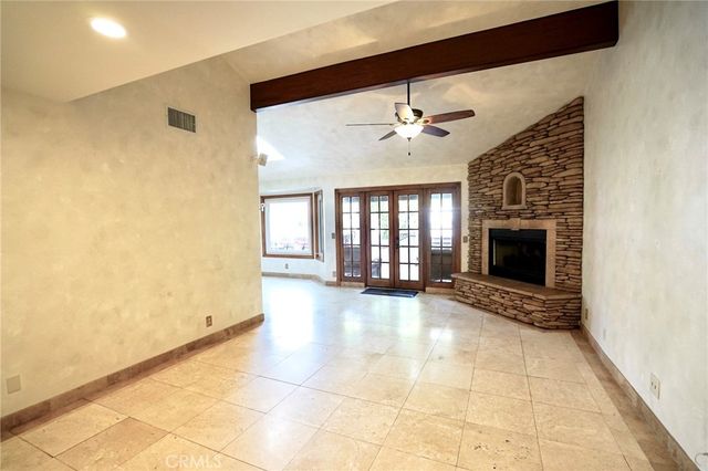 a view of a dining room with furniture and a chandelier