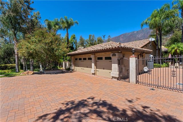 a bedroom with a bed and a large window with the outer view