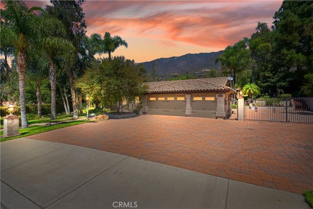 a living room with furniture and a refrigerator