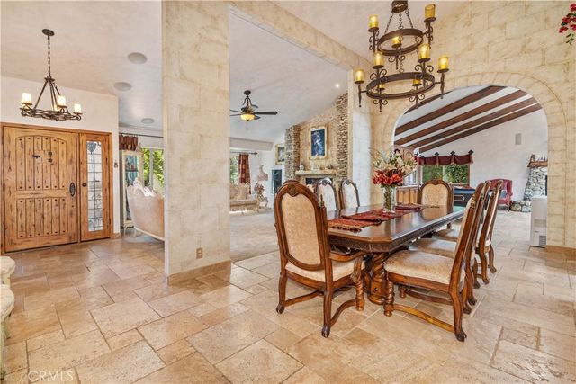 a large kitchen with a stove a sink dishwasher and a refrigerator