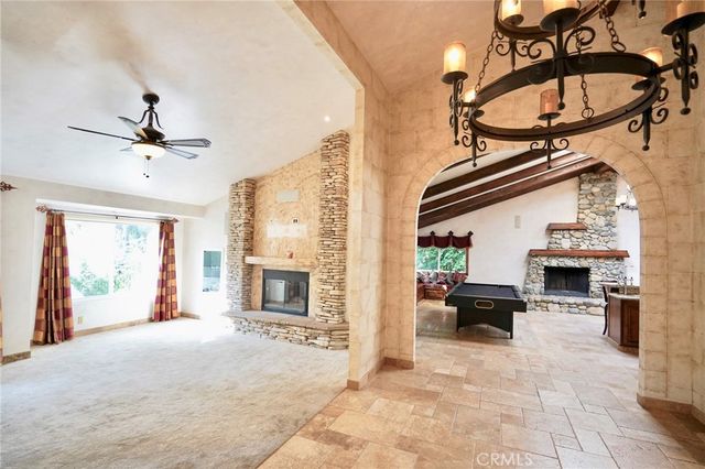 a outdoor living space with furniture and a fireplace