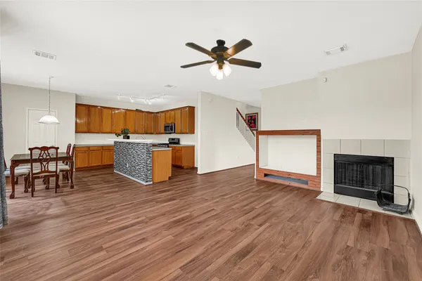 a view of kitchen with furniture and wooden floor