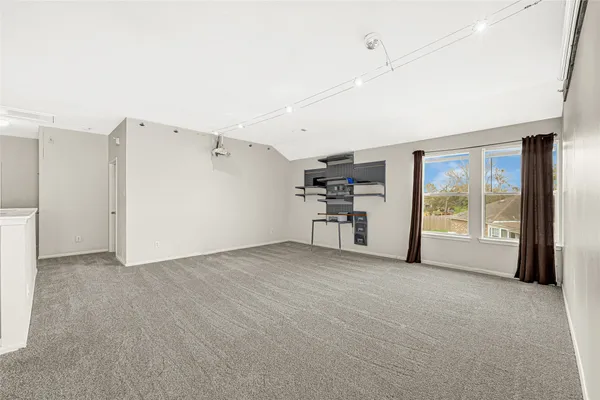 a view of a livingroom with an empty space and a fireplace