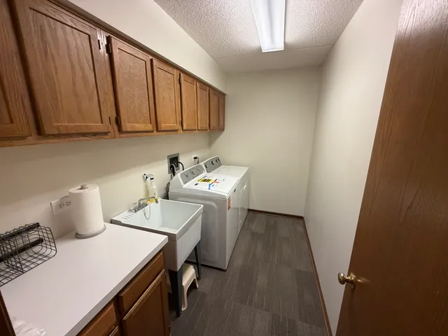 a room with a table chairs and wooden floor