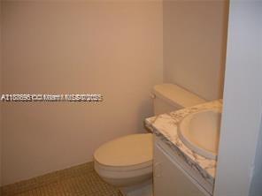 4166 Inverrary Drive, Unit 405 Lauderhill, FL 33319 - Photo 6 of 11 a bathroom with a toilet and a sink