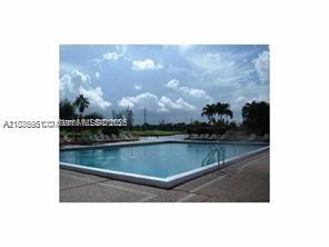 4166 Inverrary Drive, Unit 405 Lauderhill, FL 33319 - Photo 8 of 11 a view of swimming pool from a window