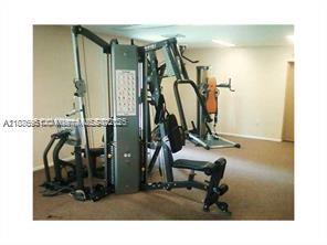 4166 Inverrary Drive, Unit 405 Lauderhill, FL 33319 - Photo 9 of 11 a view of a room with gym equipment