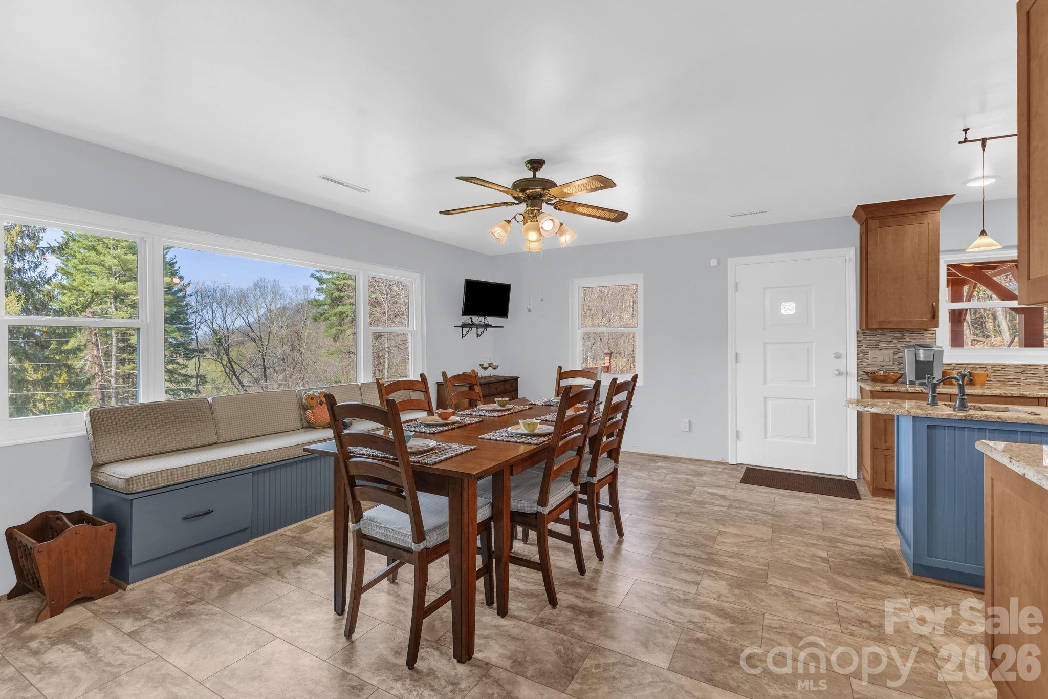 87 Rockwood Road Waynesville, NC 28786 - Photo 13 of 45 a view of a dining room with furniture window and outside view