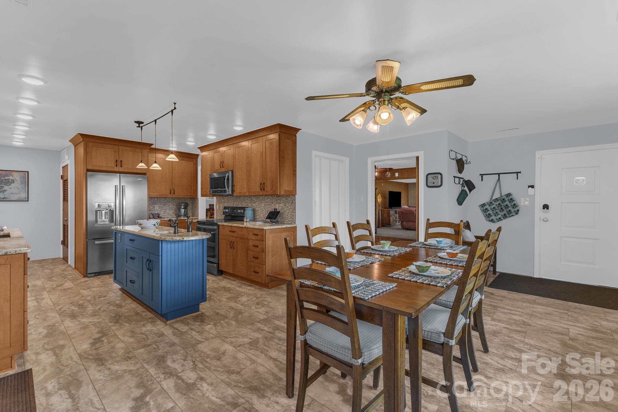 87 Rockwood Road Waynesville, NC 28786 - Photo 14 of 45 a view of a dining room with furniture window and wooden floor