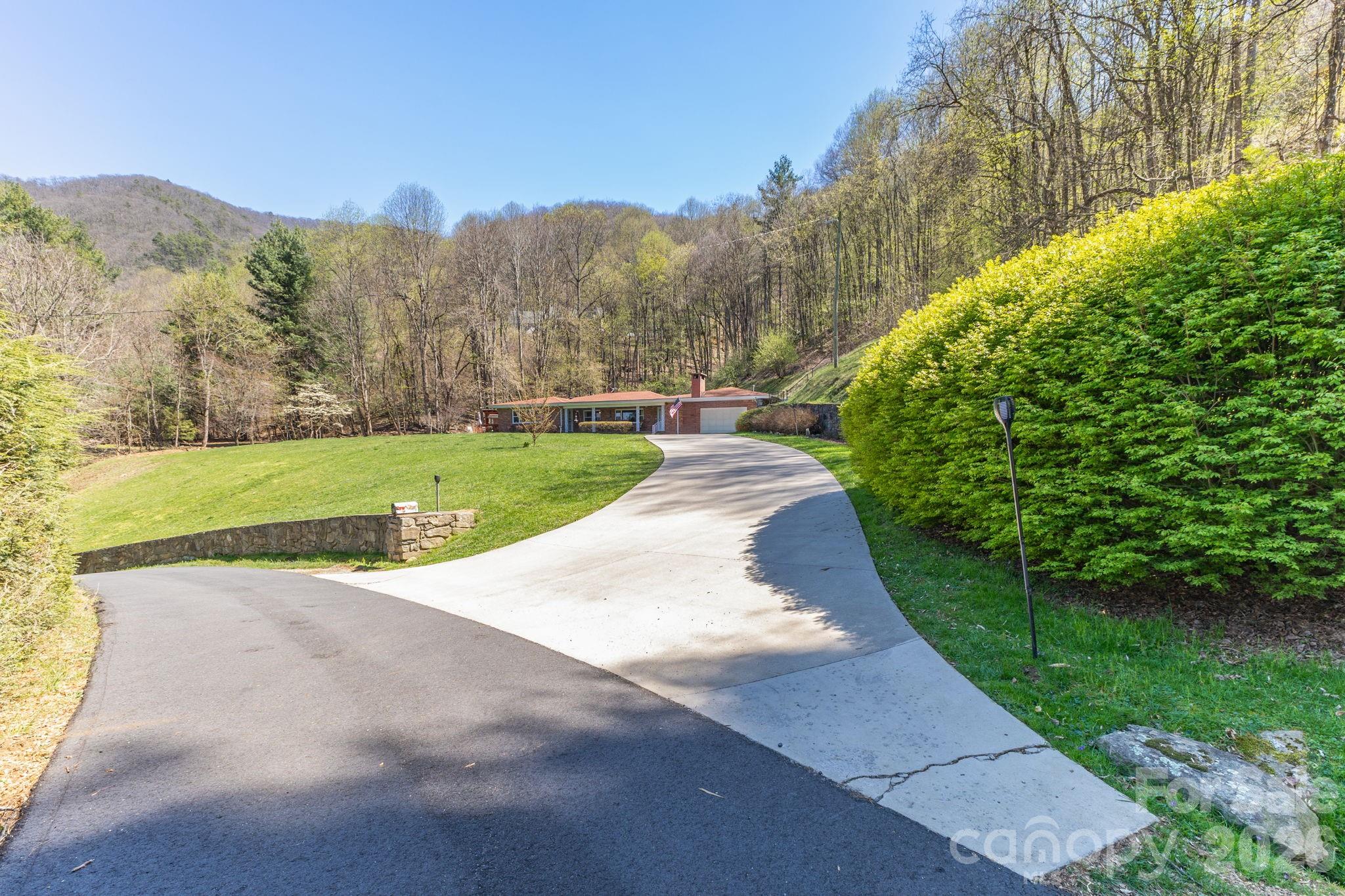 87 Rockwood Road Waynesville, NC 28786 - Photo 2 of 45 a view of a park with a large trees