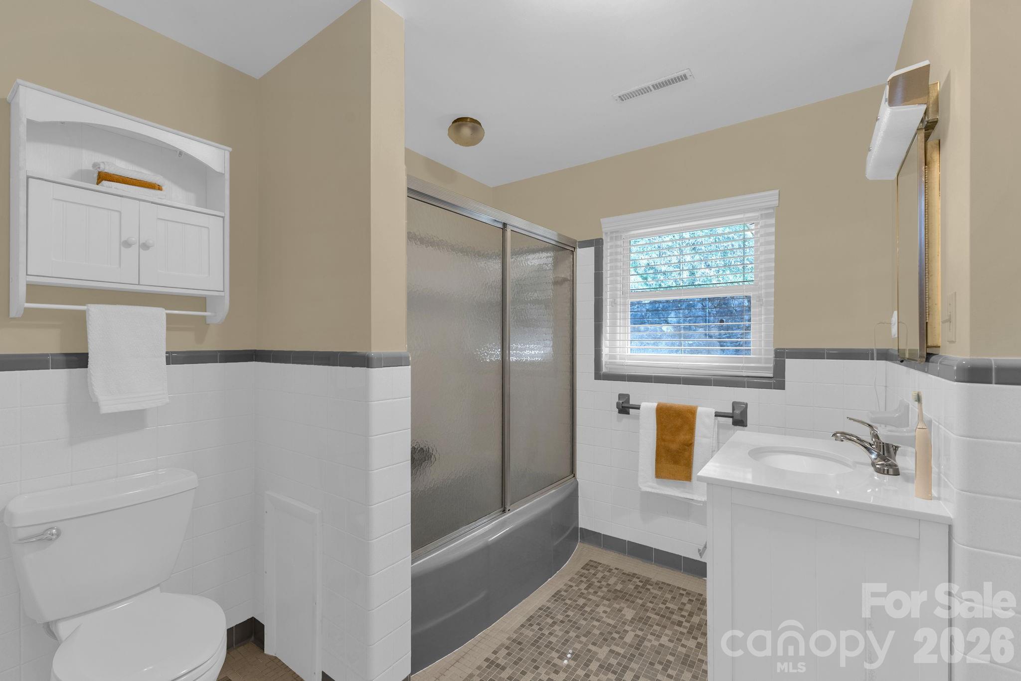 87 Rockwood Road Waynesville, NC 28786 - Photo 27 of 45 a bathroom with a sink toilet and shower