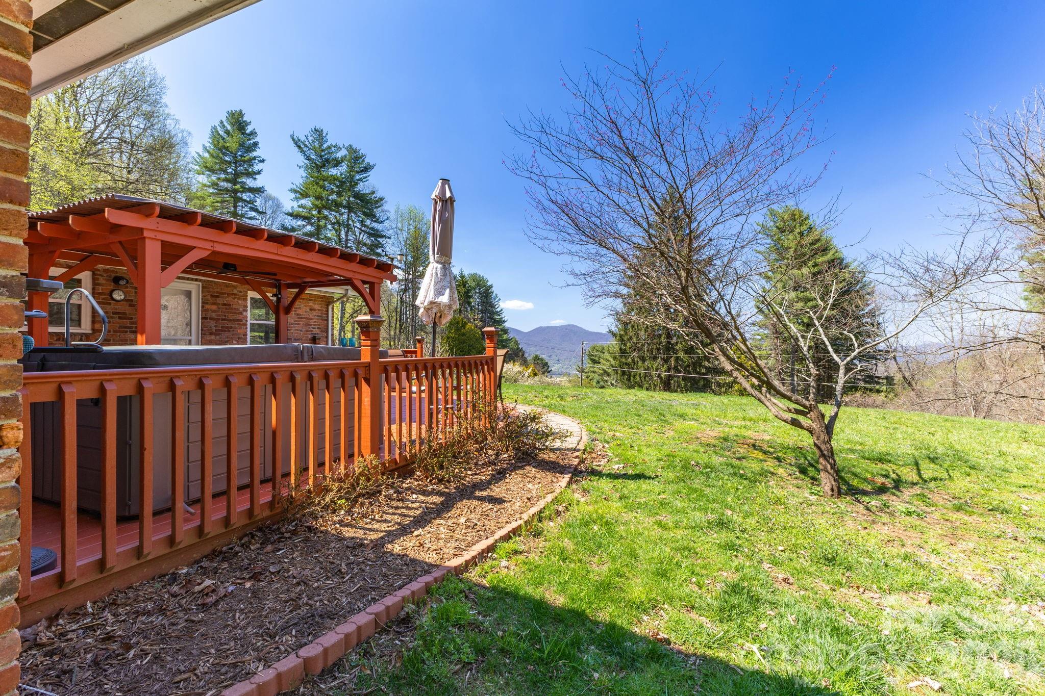 87 Rockwood Road Waynesville, NC 28786 - Photo 39 of 45 a view of a house with backyard and trees