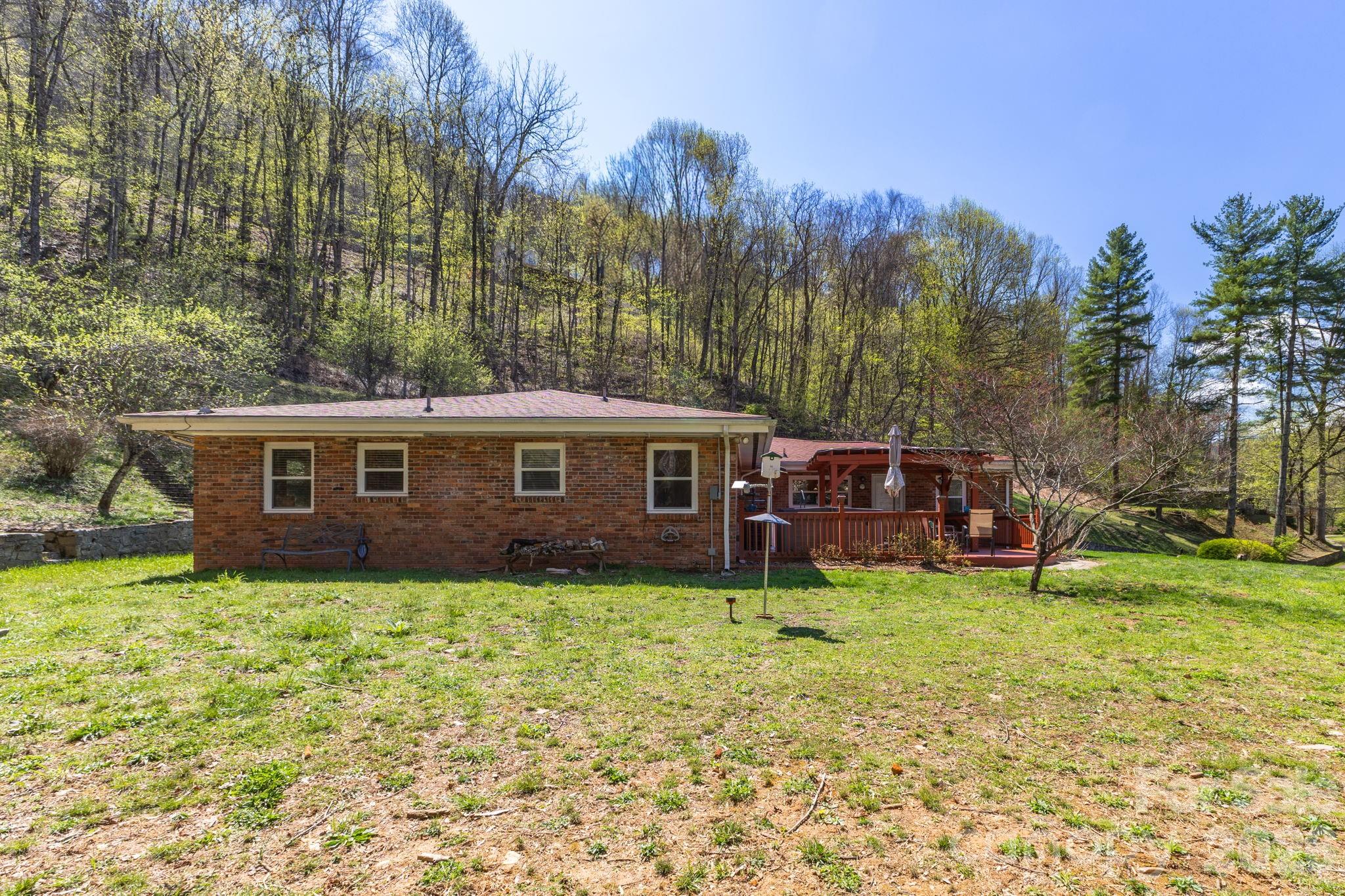 87 Rockwood Road Waynesville, NC 28786 - Photo 40 of 45 a view of a house with a yard