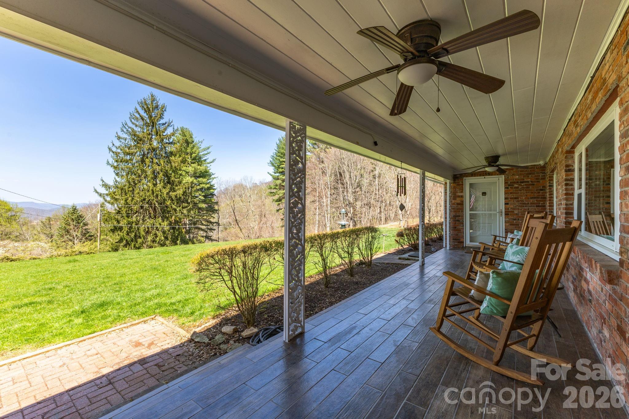 87 Rockwood Road Waynesville, NC 28786 - Photo 5 of 45 a view of a porch with furniture and garden