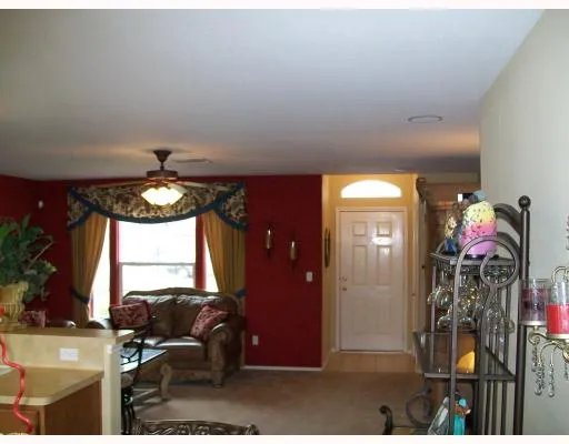 a view of a livingroom with furniture and windows