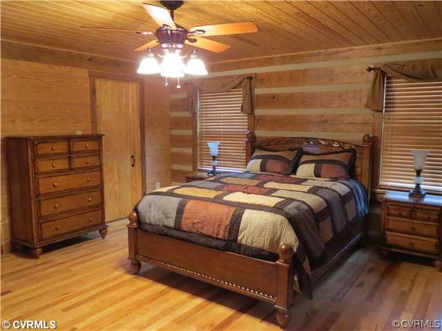 414 Buffalo Church Road Pamplin, VA 23958 - Photo 10 of 19 a bed sitting in a bedroom next to a window