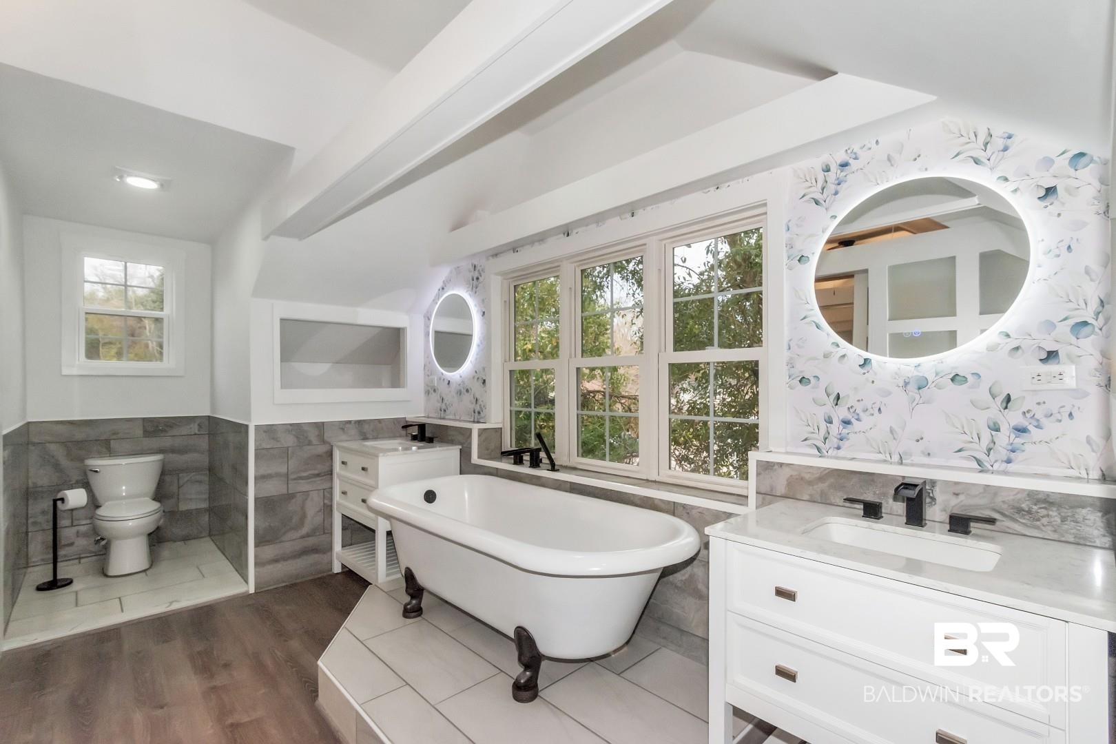 2157 Homewood Street Mobile, AL 36606 - Photo 20 of 36 Full bathroom with toilet, a sink, tile walls, a soaking tub, and wainscoting