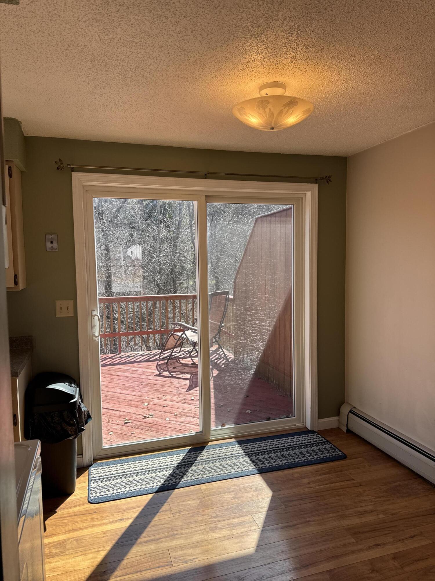 9 Cynthia Circle, Unit 9 Bangor, ME 04401 - Photo 20 of 28 Kitchen slider to deck