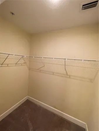 a view of a room with racks on the wall