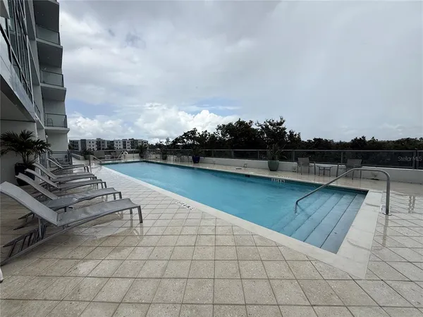 an outdoor space with lounge chair