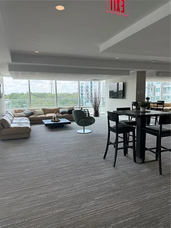 a view of a livingroom with furniture window and outside view