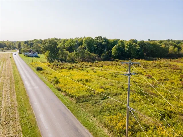 a view of a swimming pool and a yard