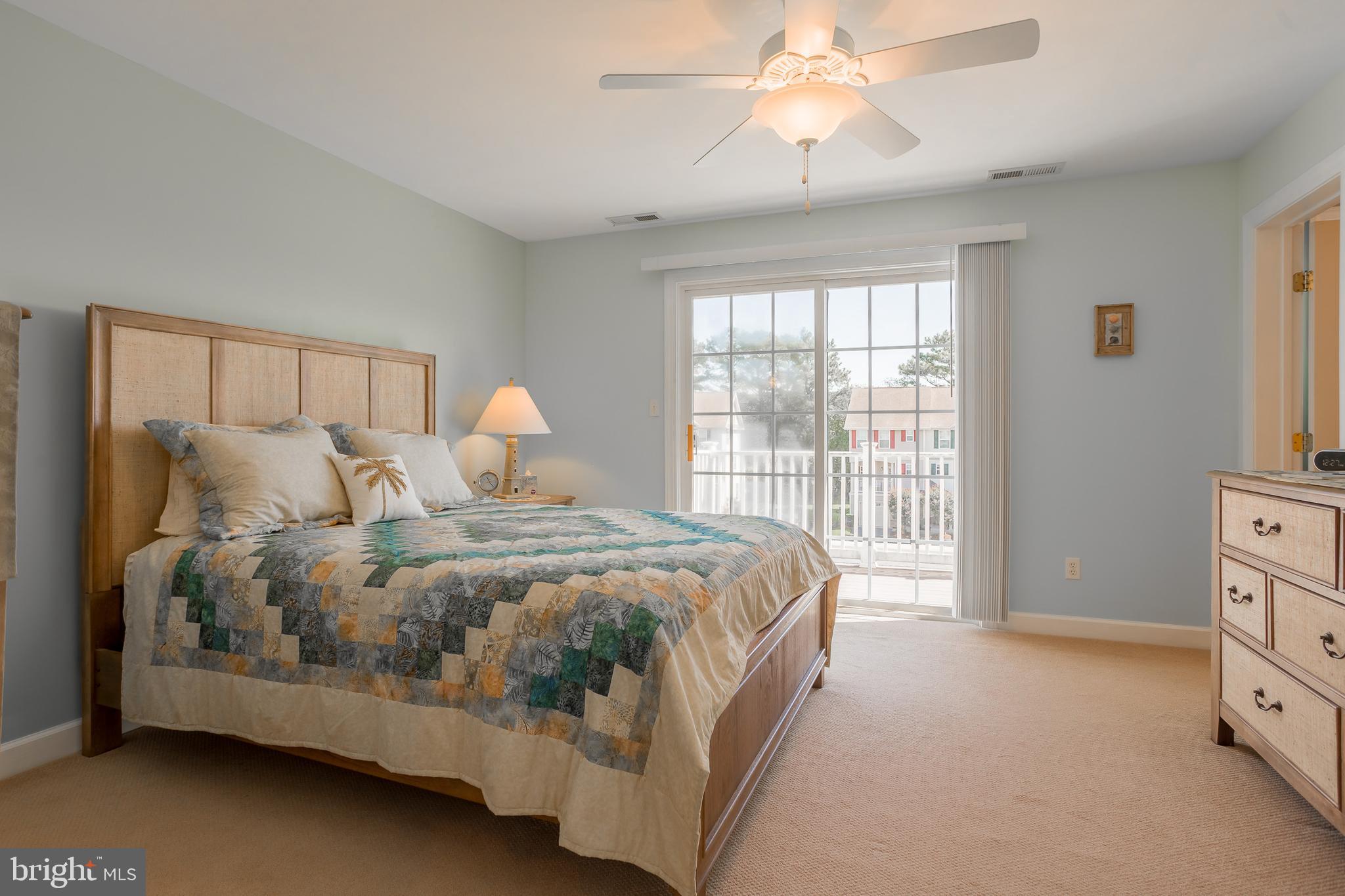 29825 Beach Air Landing Road, Unit 74 Dagsboro, DE 19939 - Photo 26 of 41 MAIN BEDROOM SUITE W/DOORS TO DECK