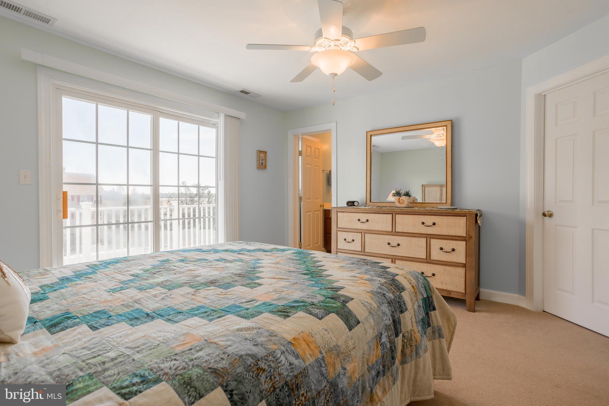 29825 Beach Air Landing Road, Unit 74 Dagsboro, DE 19939 - Photo 27 of 41 MAIN BEDROOM SUITE W/DOORS TO DECK