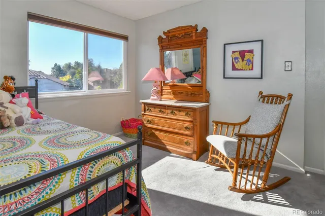 a view of a dining room with furniture and window