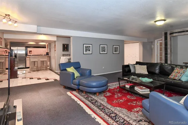 a living room with furniture and a table