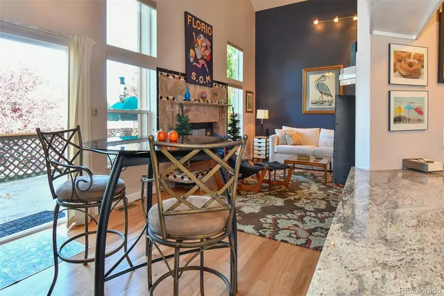 a view of a dining room with furniture and a window