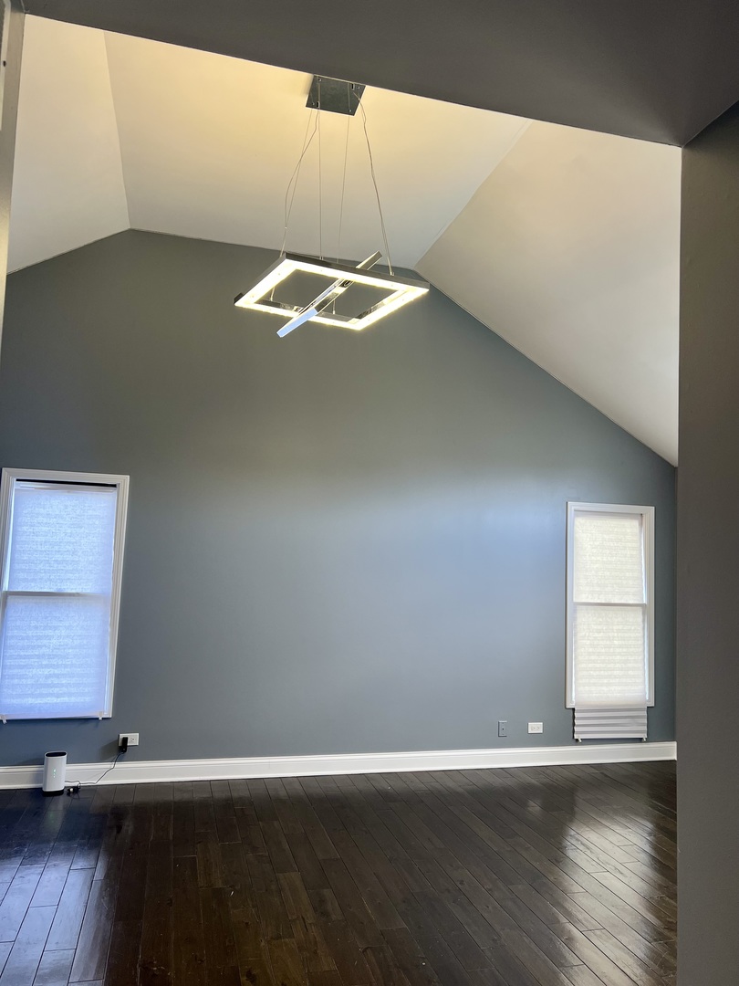2472 Worthington Drive Aurora, IL 60506 - Photo 11 of 26 a view of an empty room with wooden floor and a window