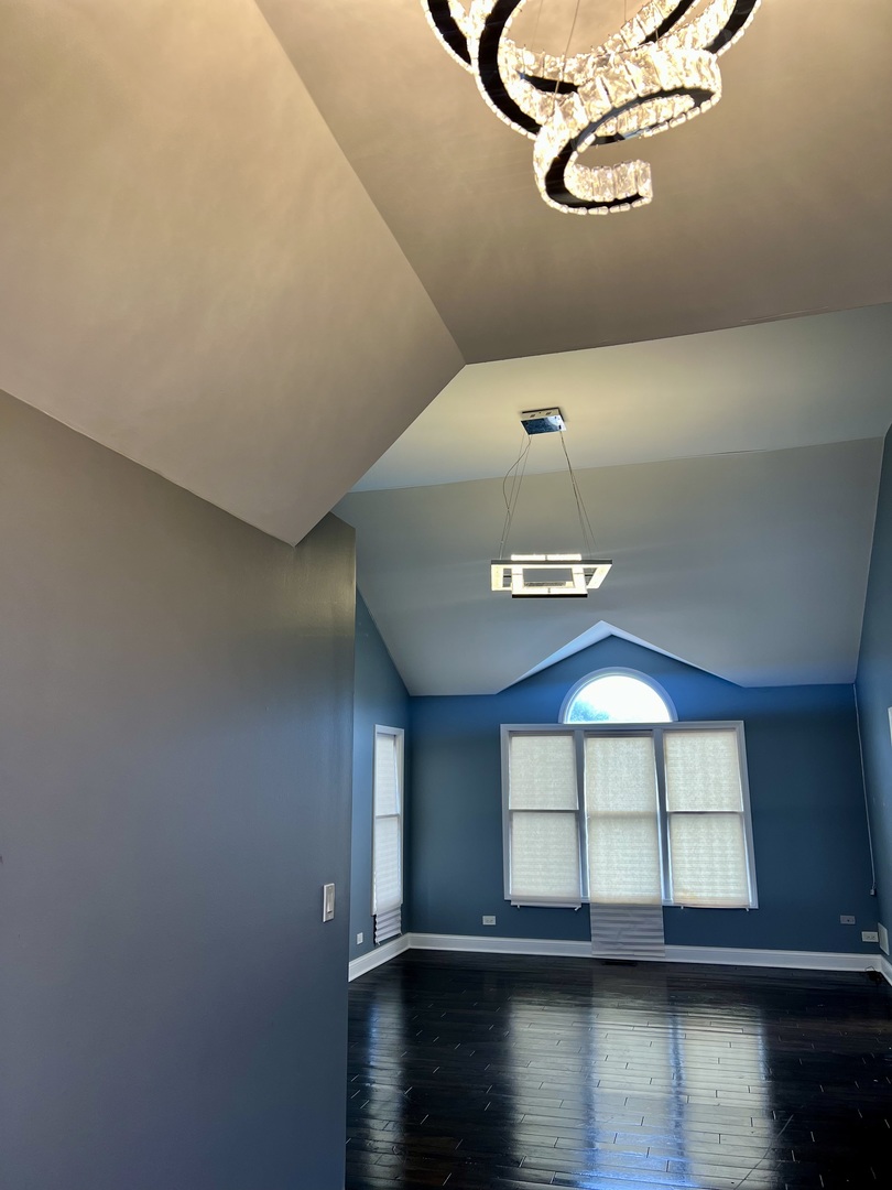 2472 Worthington Drive Aurora, IL 60506 - Photo 12 of 26 a view of empty room with wooden floor and fan