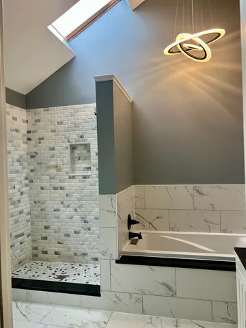 a bedroom with a bed and a ceiling fan