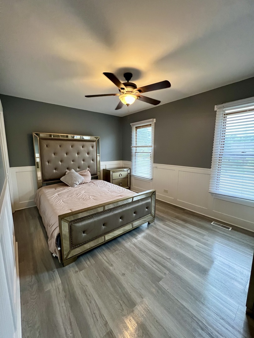 2472 Worthington Drive Aurora, IL 60506 - Photo 16 of 26 a bedroom with a bed and a ceiling fan