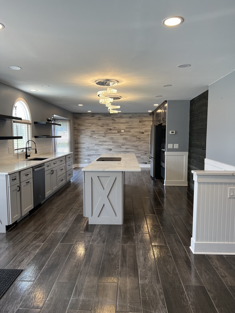 2472 Worthington Drive Aurora, IL 60506 - Photo 2 of 26 a kitchen with stainless steel appliances a stove a sink and a refrigerator